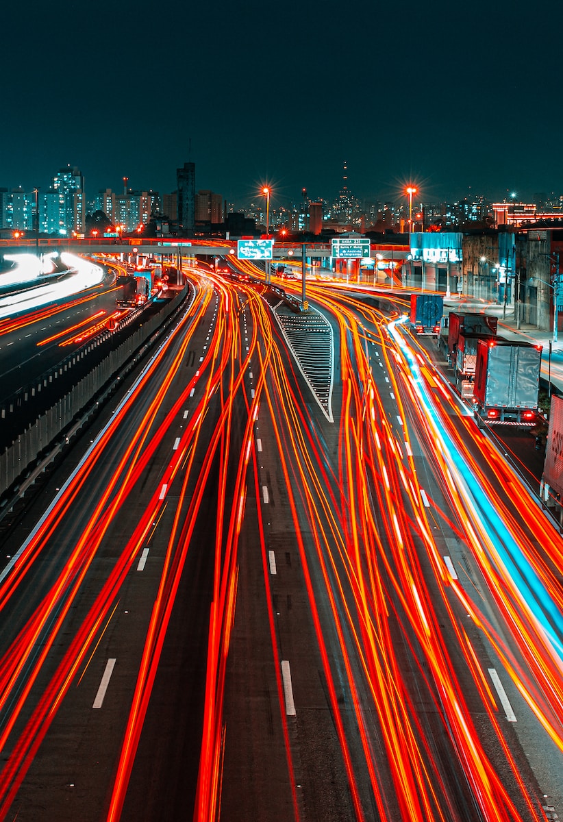 time lapse photography of cars on road during night time